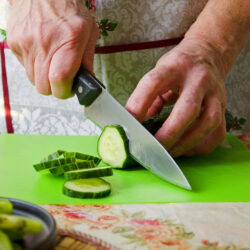 Person chopping vegetables, occupational activity