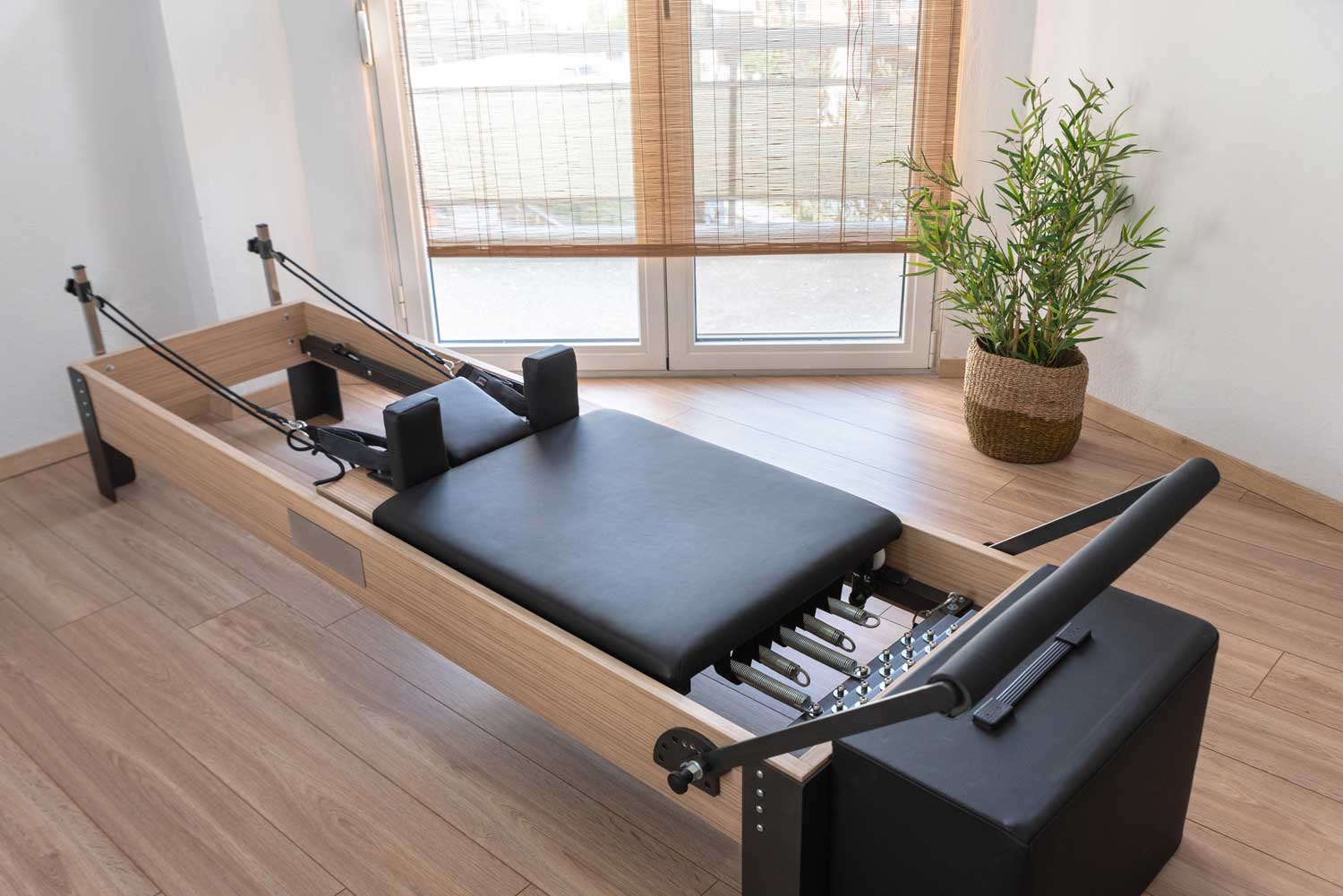 Pilates Reformer apparatus used in the exercises invented by Joseph Pilates | Spine & Sport PT | Rancho Santa Margarita, CA Clinic