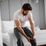 Man with knee pain trying home pain remedies | Spine & Sport Physical Therapy | San Diego, Irvine, Sacramento, CA